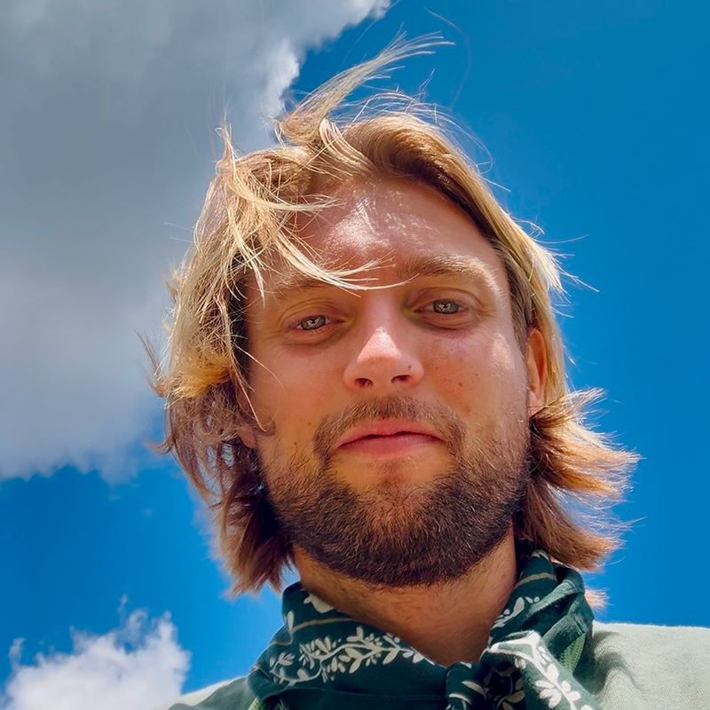 Richard Keiner, smiling under a blue sky